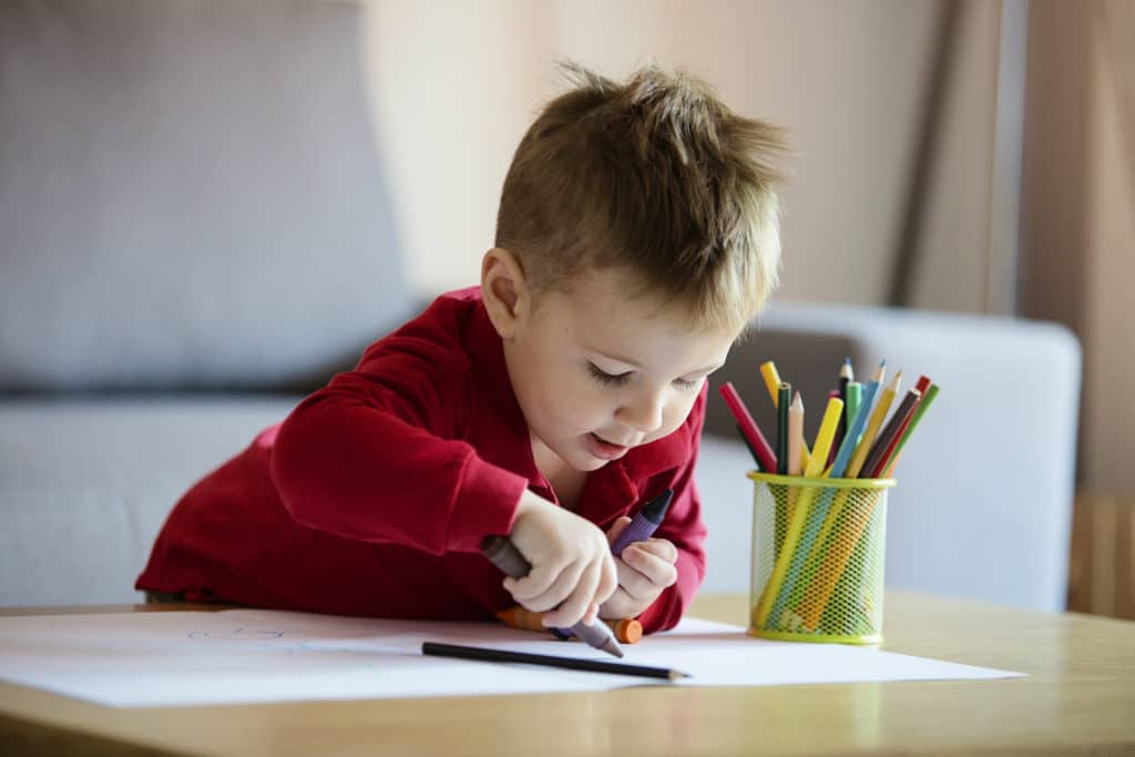 Little boy colouring