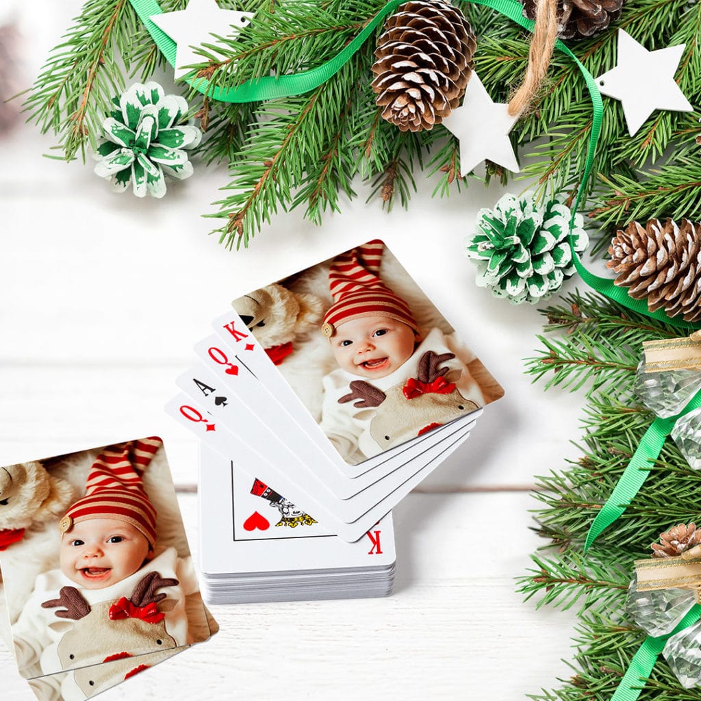 customised playing cards under Christmas tree