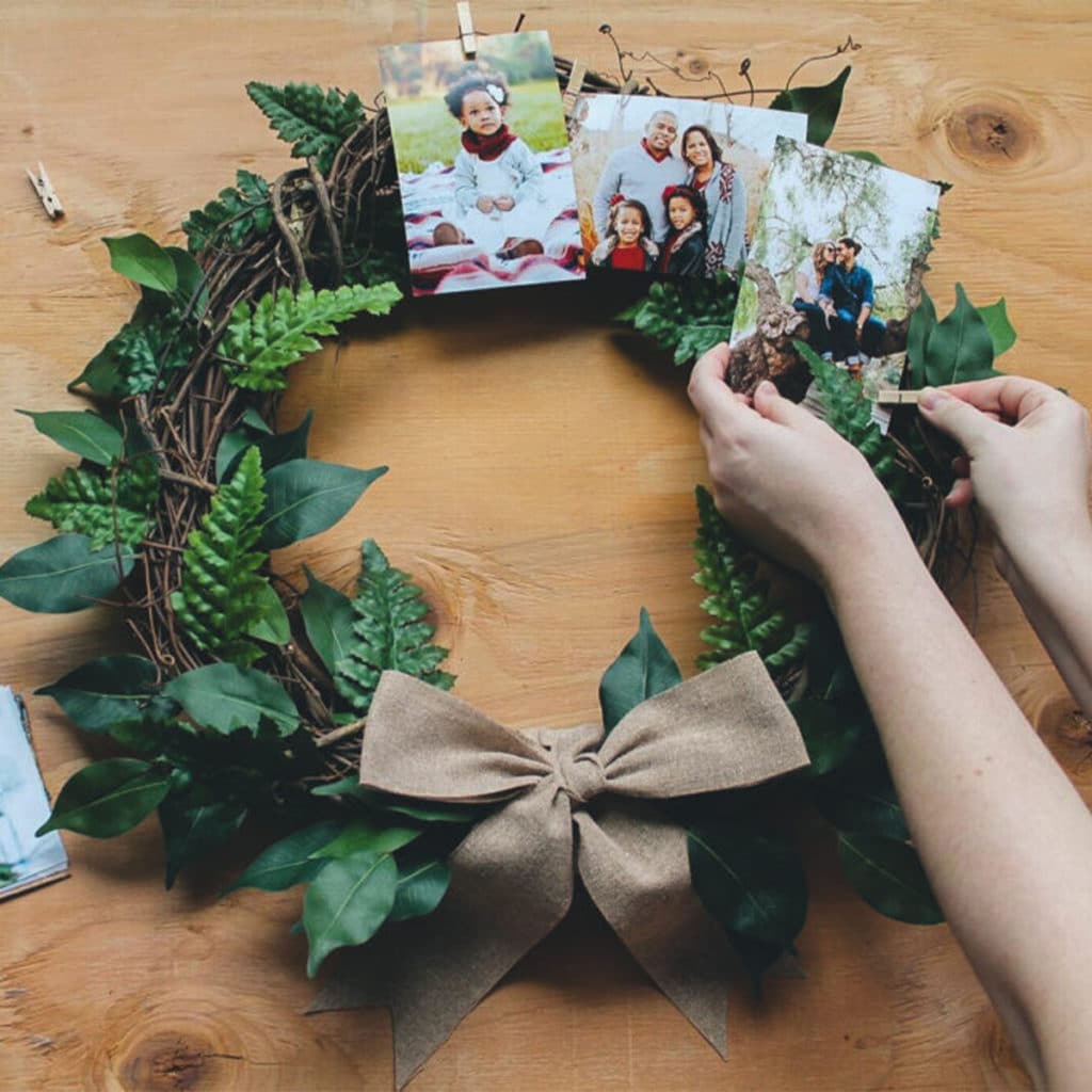 Peg Christmas cards on wreaths and garlands