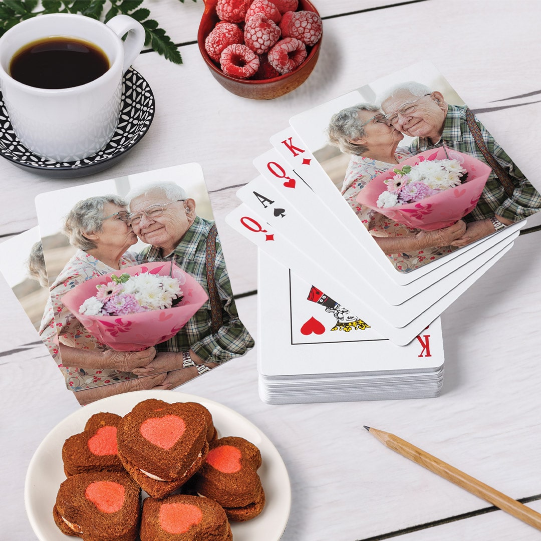 photo card deck next to heart cookies