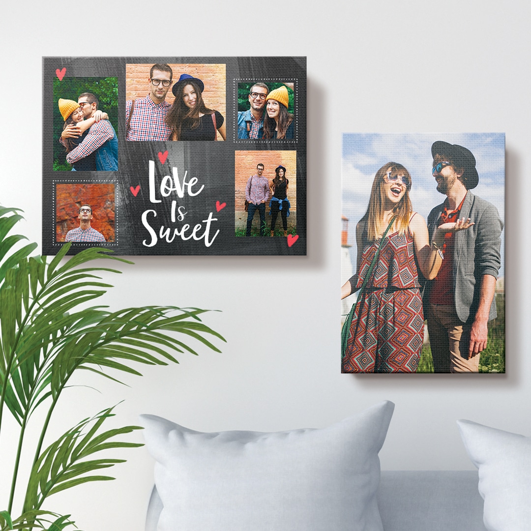 two photo canvas prints hanging above a blue sofa