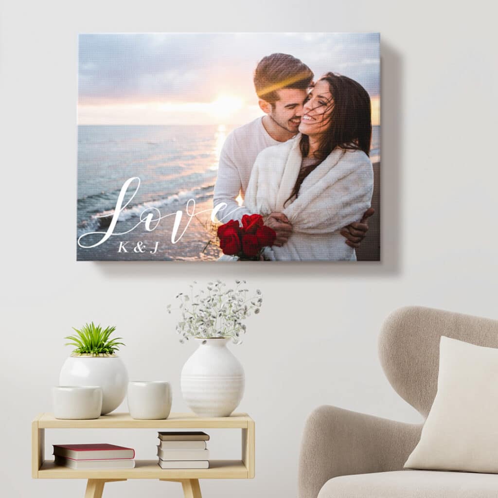 canvas on wall showing couple on beach and Love embellishment