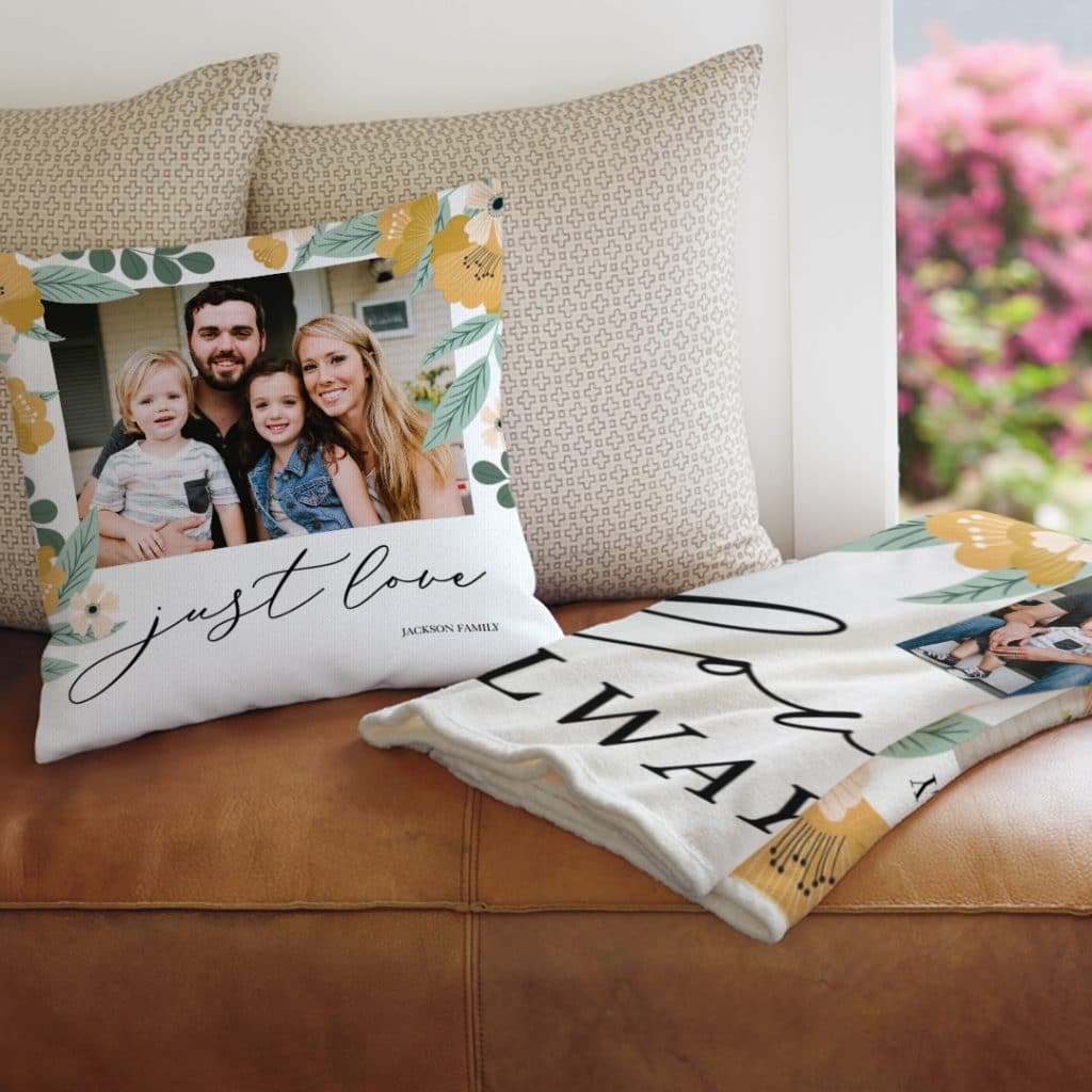 A photo cushion and photo blanket lying on a sofa
