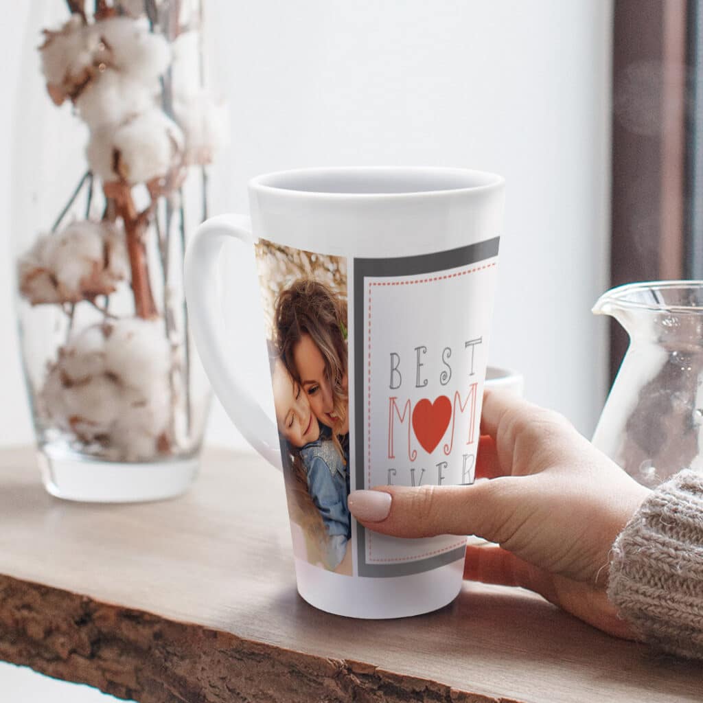 woman holding latte mug