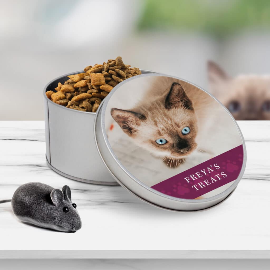 round tin containing pet treats on a table