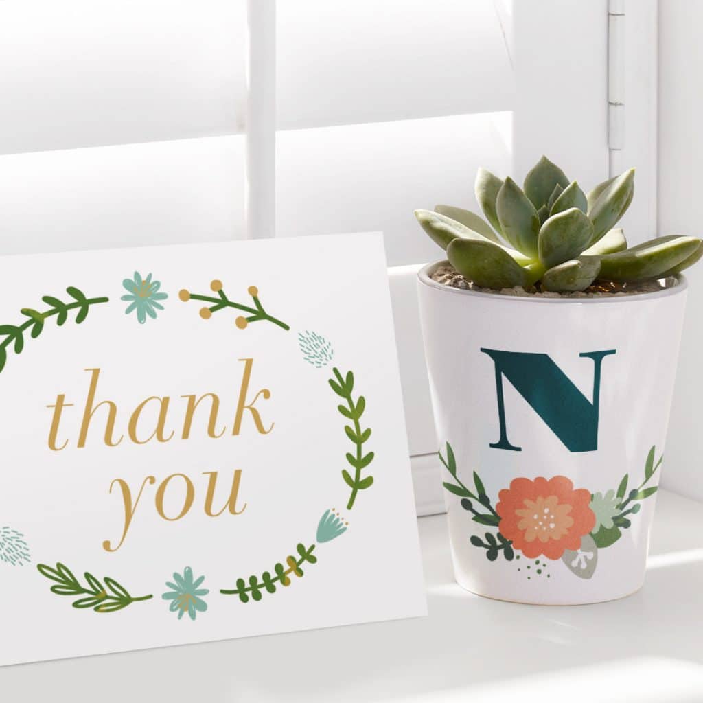 Minimalist designs shown on a plant pot and a thank you notecard