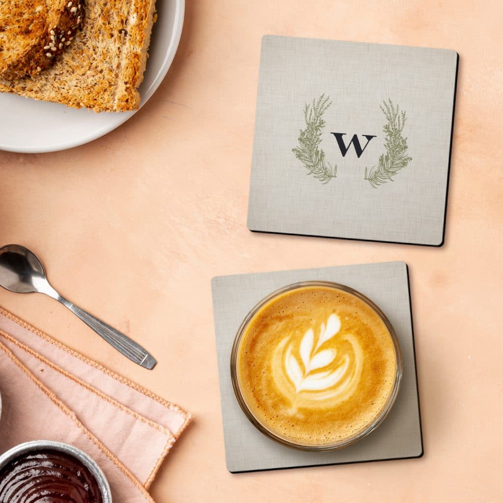 Personalised monogram coasters displayed on the breakfast table