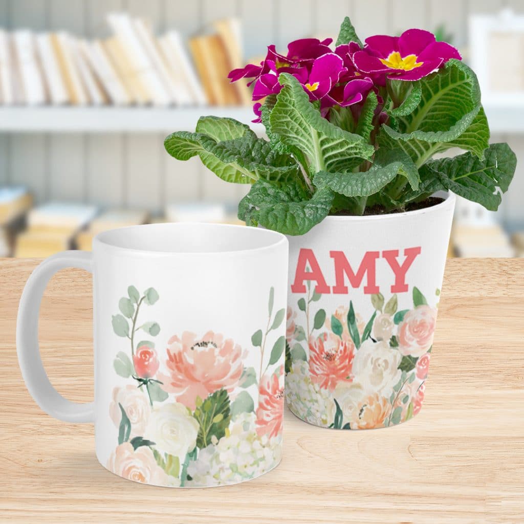 A plant pot and mug showing a floral watercolour design