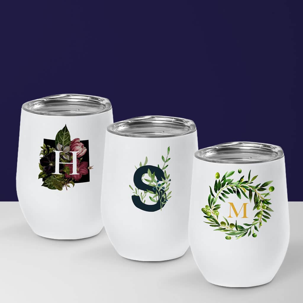 Three wine cups with monogram designs