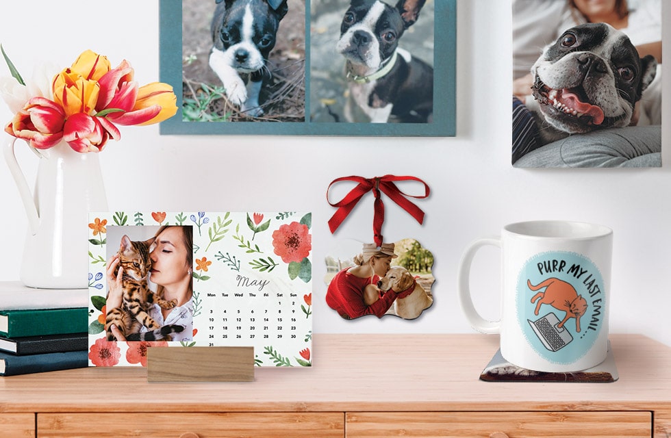 woodblock easel calendar, ornament, mug and canvas on desk