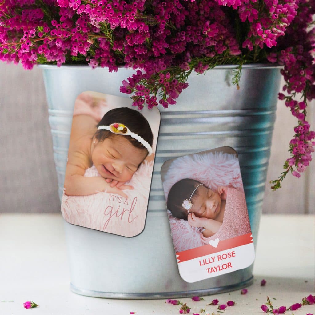 New baby announcement magnets on plant pot