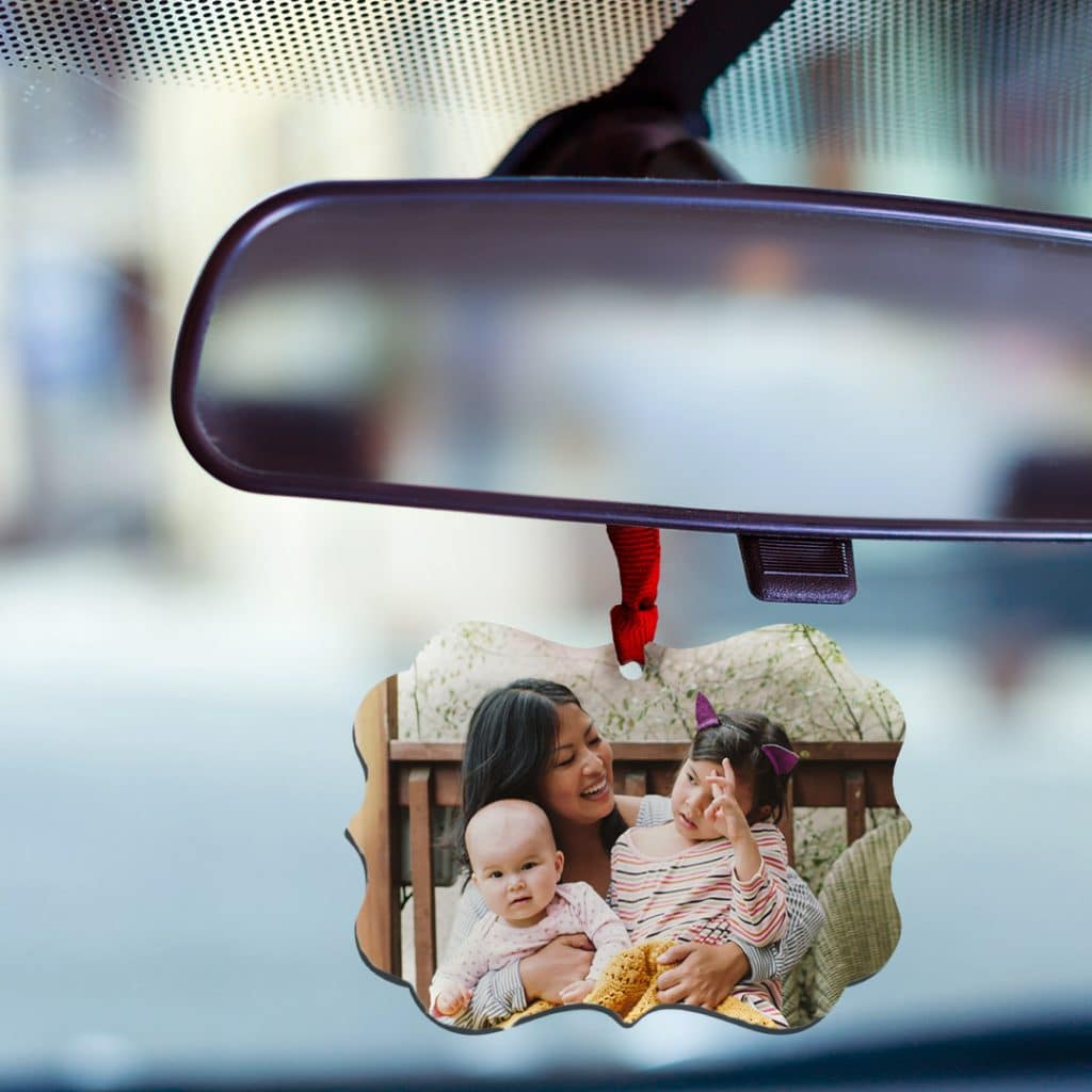 ornament hanging off car mirror