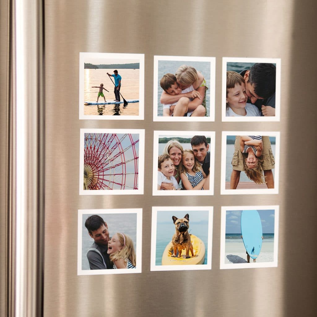Collection of mini square photo magnets on fridge door