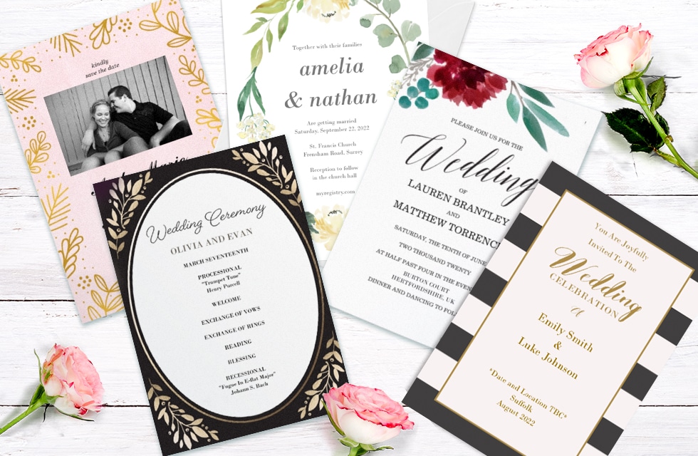 four wedding invites surrounded by flowers