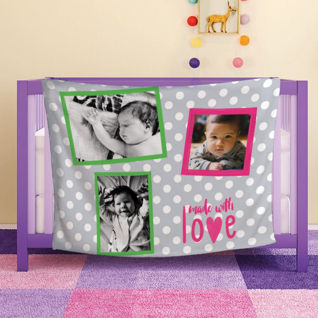 baby photo blanket draped over side of cot