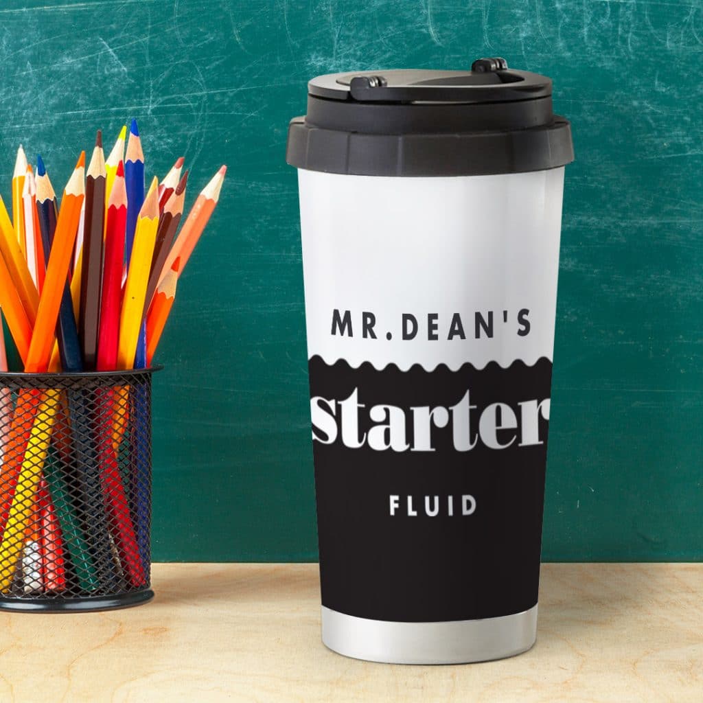 A personalised travel mug on the teacher's desk