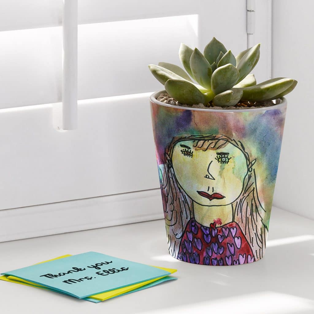 A plant pot personalised with kids art to thank the teacher
