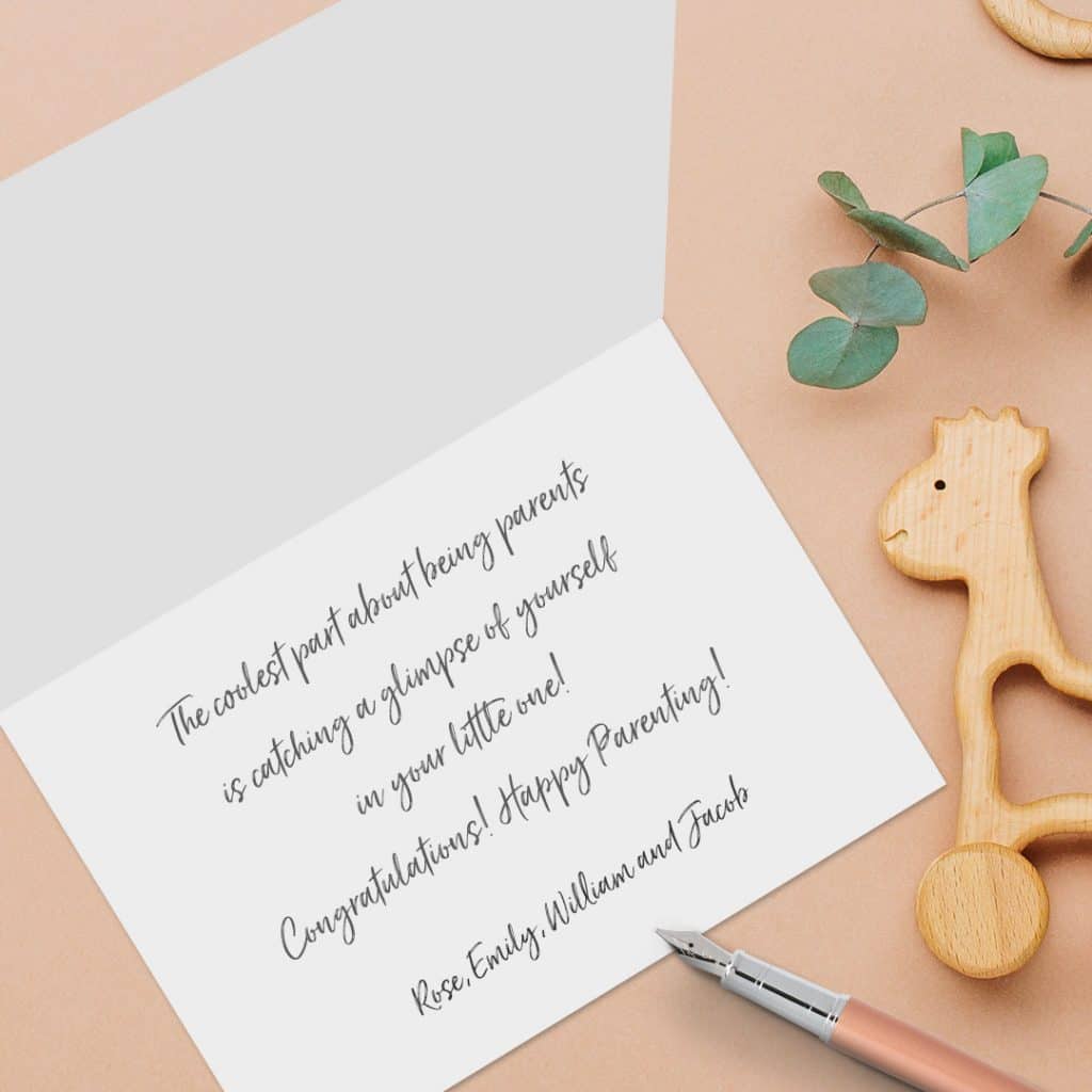 An open card with congratulations text for new parents written on it