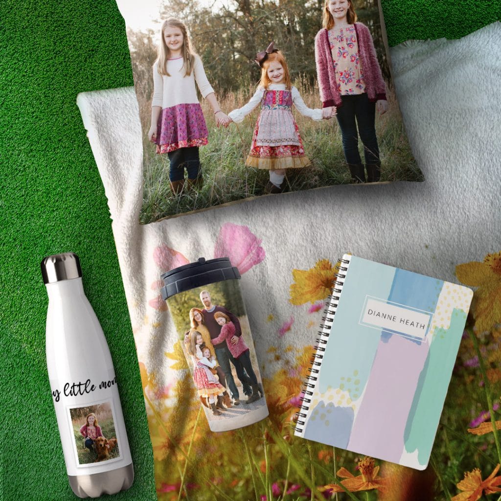 photo cushion, notebook, travel mug, and water bottle on photo blanket to remember staycation
