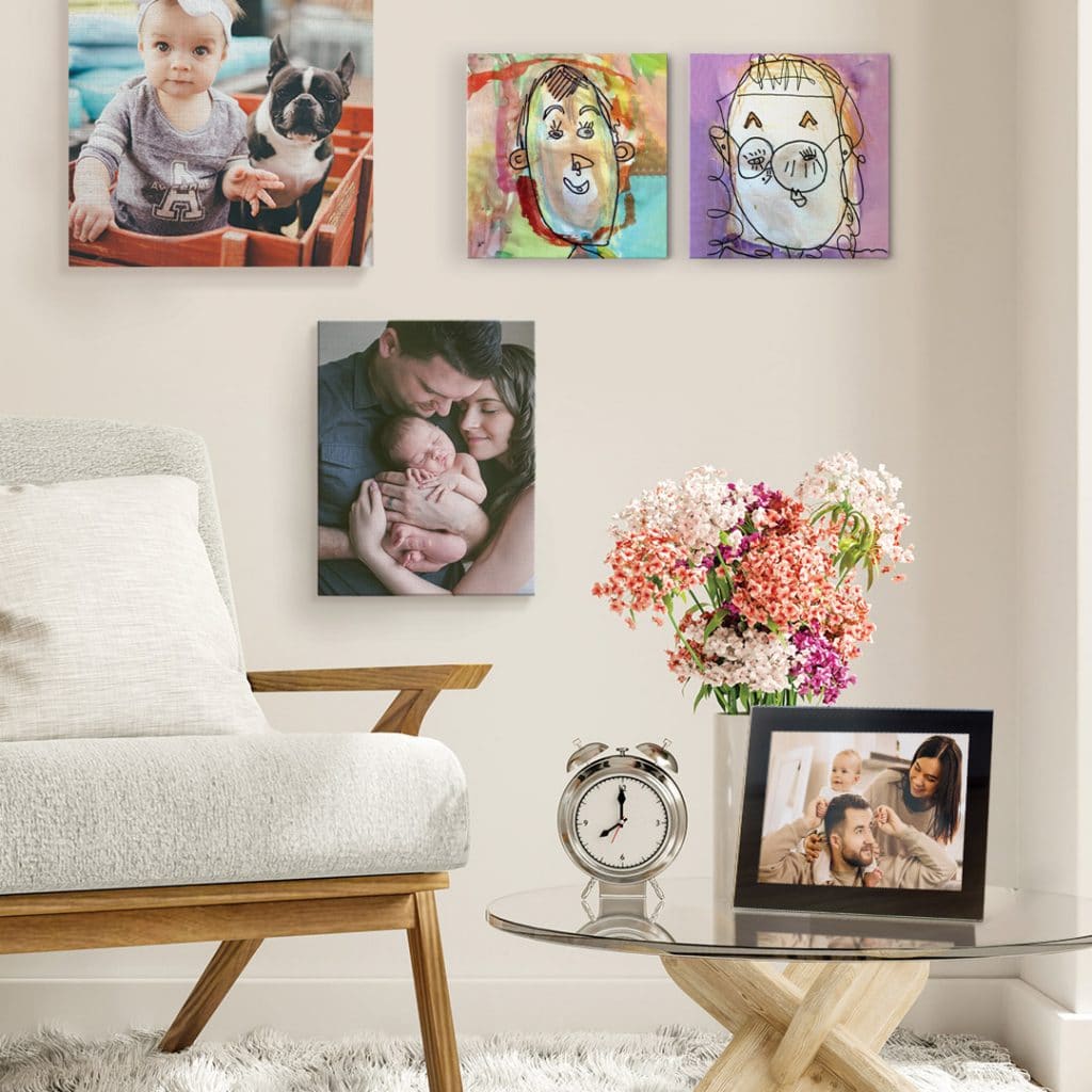 photo canvases on the wall in a living room, framed print on coffee table