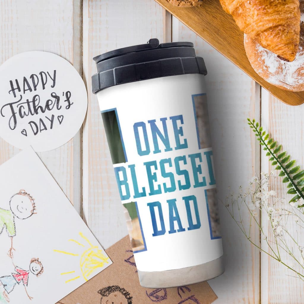 One Blessed Dad personalised travel mug design with kids art on a table