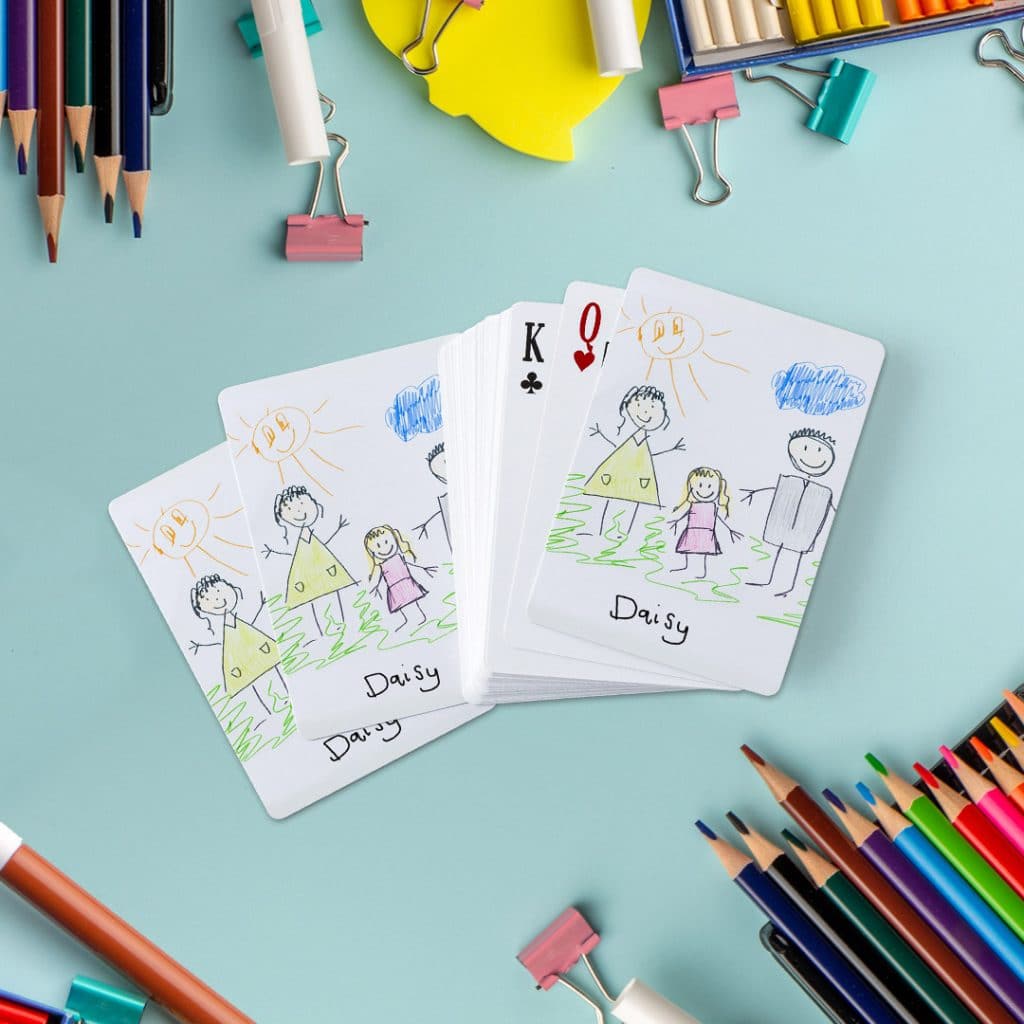 playing cards printed with kids' art pictures