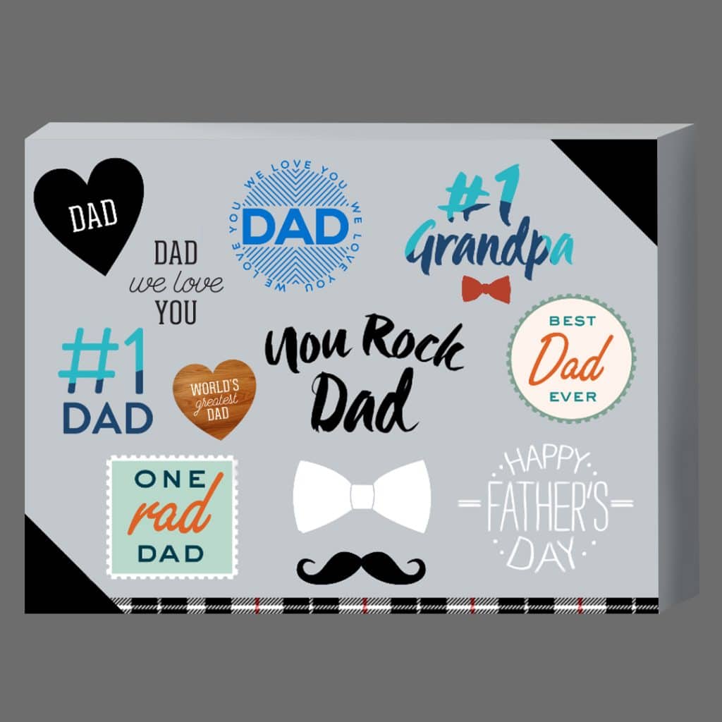 Selection of Father's Day embellishments on canvas print.
