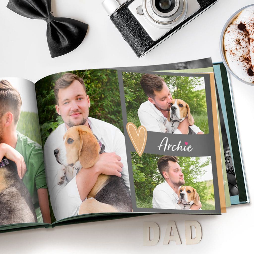 open photo book showing photos of Dad with pet dog