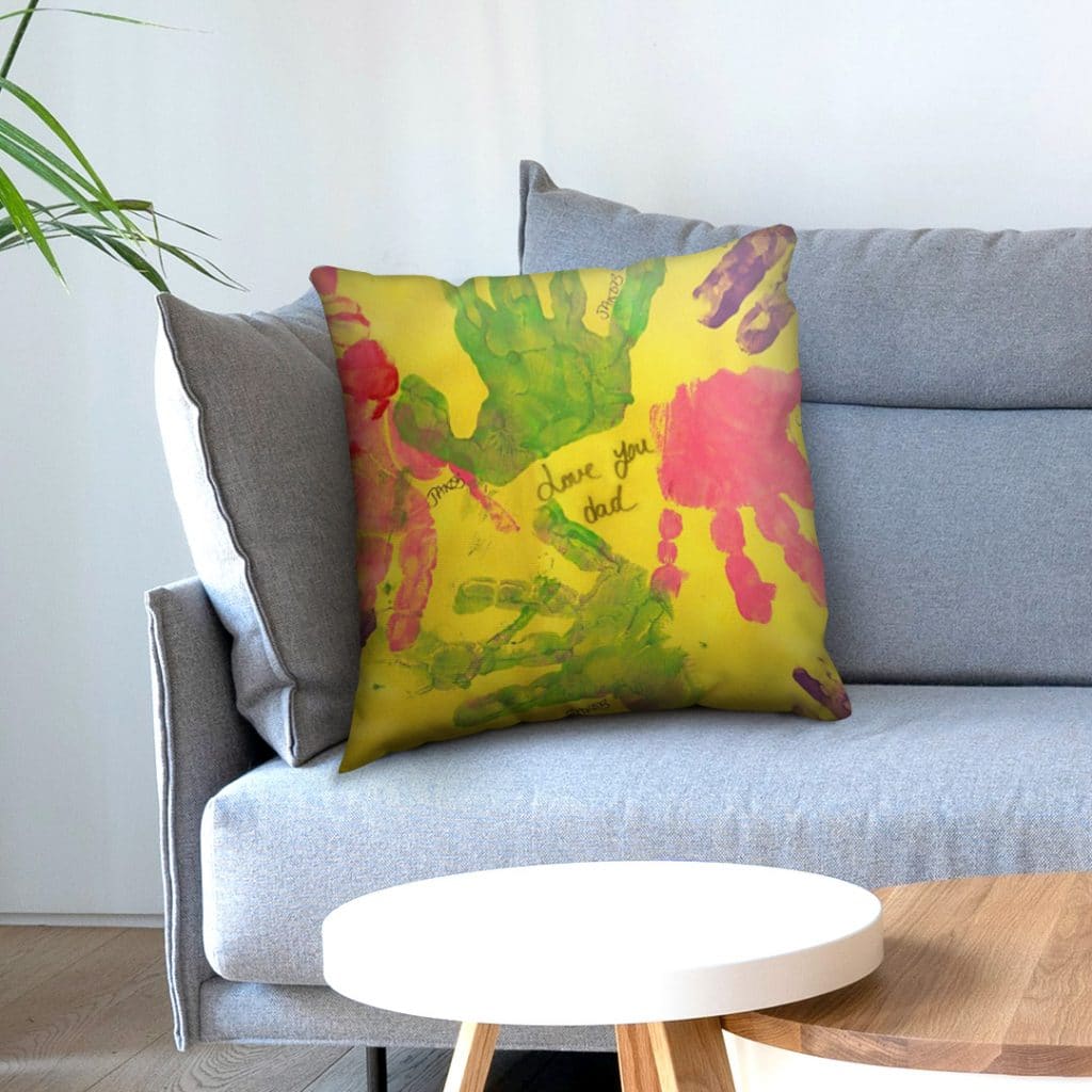 Make a photo cushion with kids' handprints for your sofa using the free Snapfish app