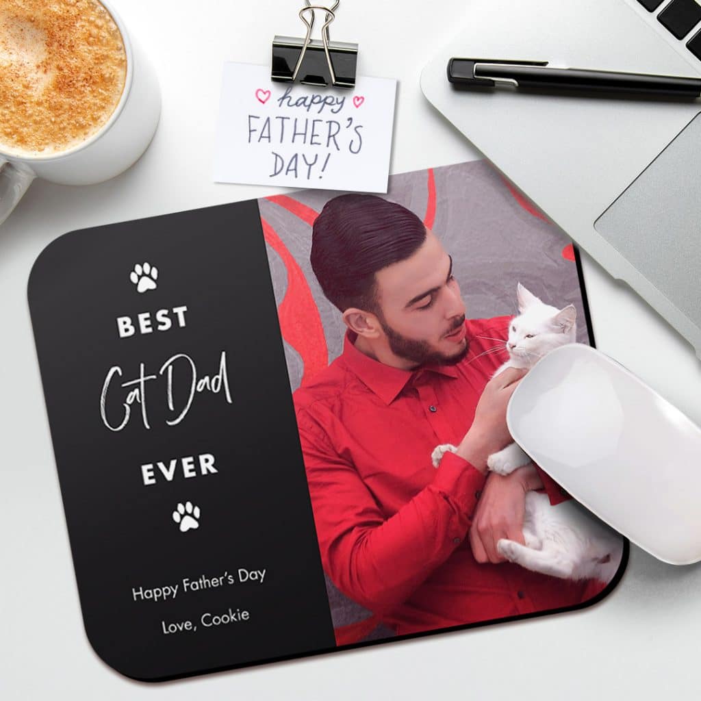 Personalised Cat Dad mousemat design shown with pictures with a young man and a cat next to laptop