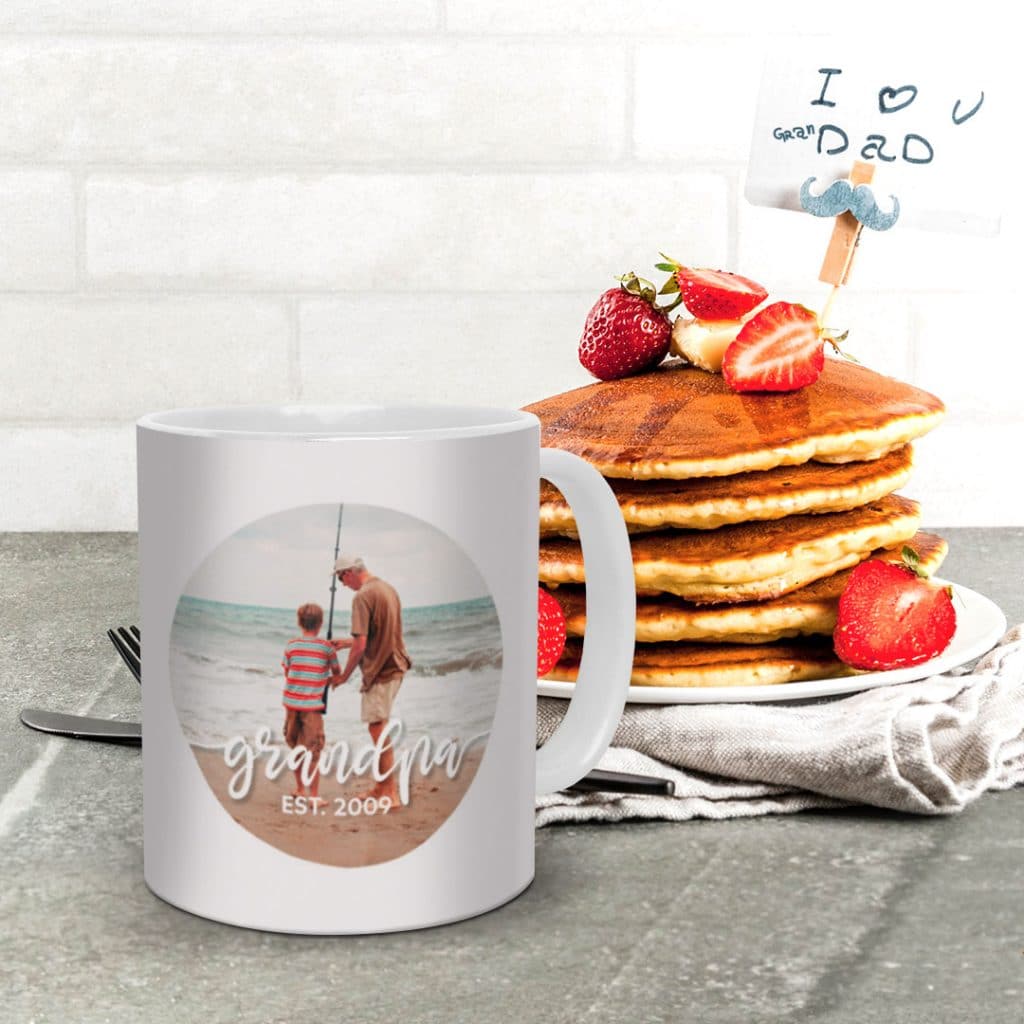 Family Pen photo mug design for Grandad next to pancakes on a table