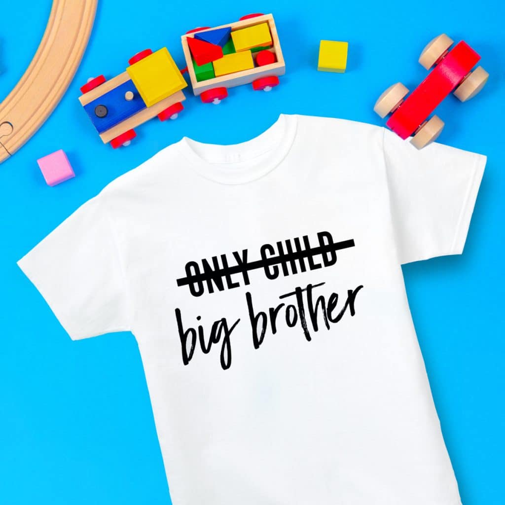 White t-shirt reading "only child" crossed out with "big brother" underneath
