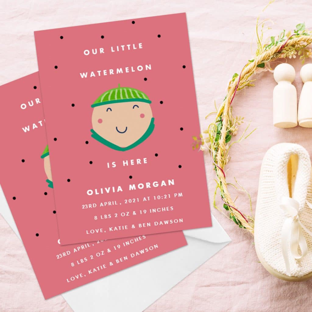 Our little watermelon is here, a funny custom baby birth announcement card placed next to white baby shoes