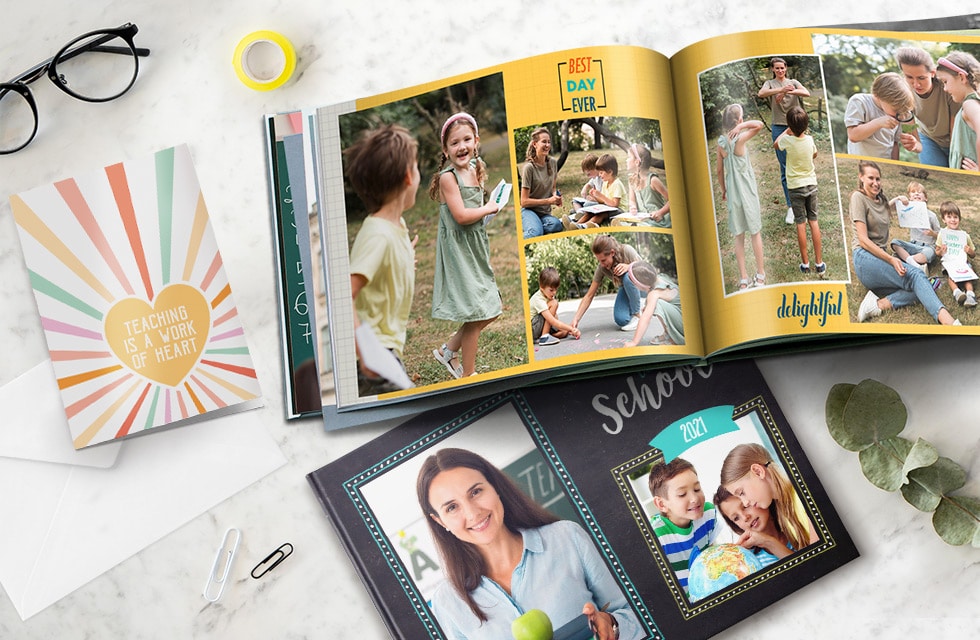 Two thank you teacher photo books with vivid images of children and teachers, and a colorful greeting card